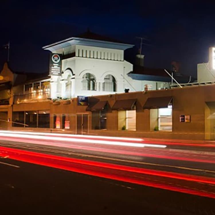 The exterior at night of the Cross Keys Hotel in the heart of Essendon.